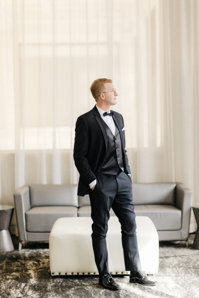 portrait of groom in black tux