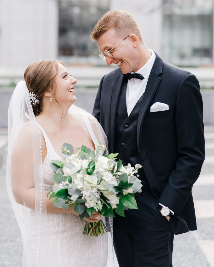 Bride and groom sharing a joyful smile during their wedding day at Embassy Suites Pittsburgh Downtown.