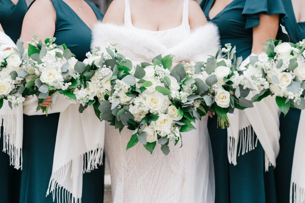 Close-up of bridesmaids’ bouquets with elegant floral arrangements at Embassy Suites Pittsburgh Downtown.