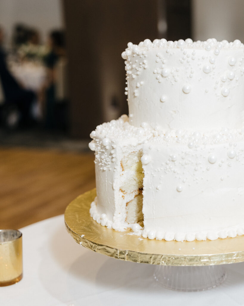 Close-up of the wedding cake after being cut, showcasing its elegant layers at Embassy Suites Pittsburgh Downtown.