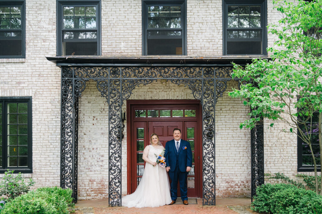 Bride and groom with mansion backdrop Pennsylvania