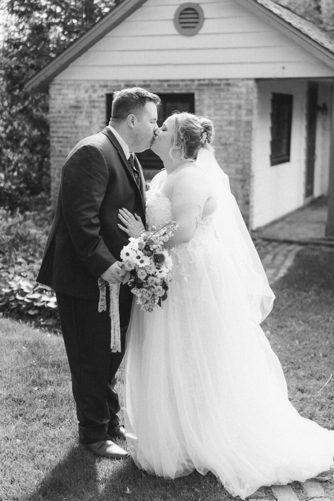 Newlyweds kissing Succop mansion steps Pennsylvania