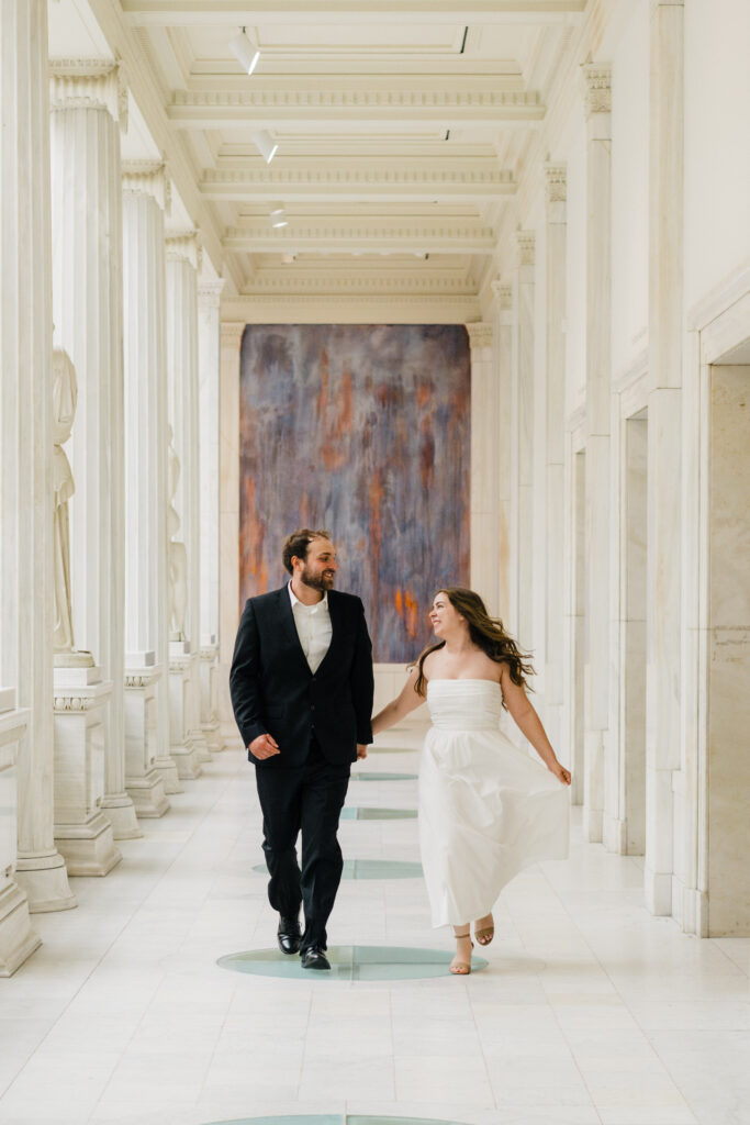 Pittsburgh engagement photos walking inside Carnegie Hall of Sculpture